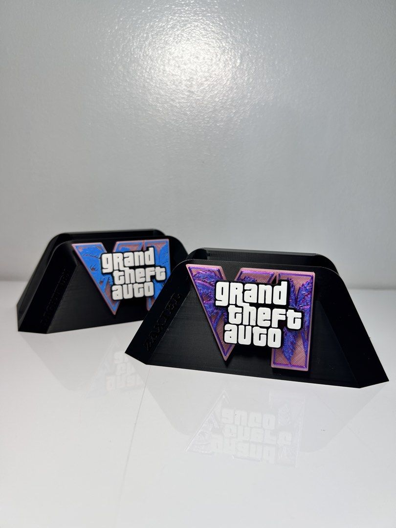 GTA VI PS5 Controller Stand (No Controller) (Category: Controllers) located in Manila. Submitted by geeelll03 (Listing ID 1450288829, Image 3). Description: - 3D Printed Cool stand for your PS5 controller. - Features the iconic Grand Theft Auto VI logo. - Perfect for displaying your controller. - Made from durable, high-quality material. - A must-have collectible for any GTA fan!.
