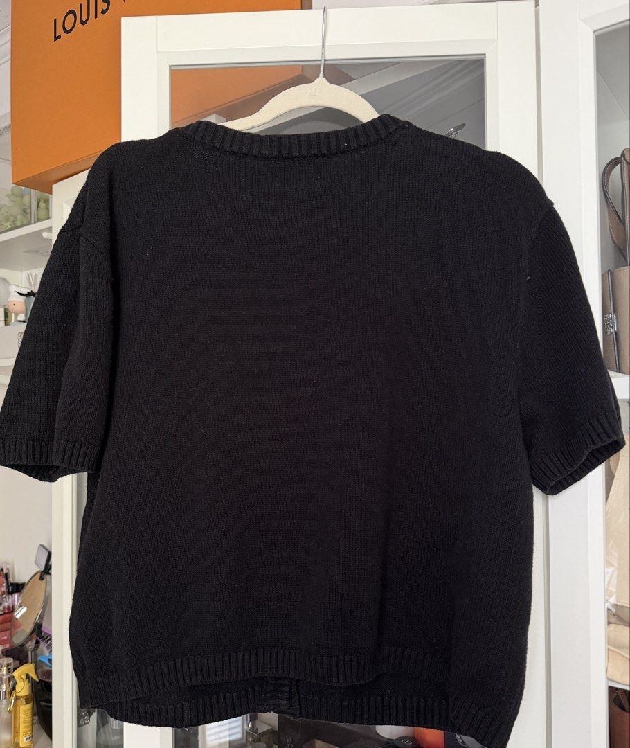 H&M Black Short Sleeve Button Up Knitted Blouse (Category: Coats, Jackets and Outerwear) located in Cavite. Submitted by mcxmcxmc (Listing ID 1450145394, Image 2). Description: - Button-up front - Two front pockets - Size: XL - Used once only.
