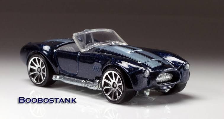 Hot Wheels Shelby Cobra Dark Blue (Category: Vehicle & Diecast Models) located in Quezon City. Submitted by caseybrian47891 (Listing ID 1450170770, Image 1). Description: Hot Wheels Shelby Cobra 427 Dark Blue ( Rare ) -Bnew mint carded -Has an opening hood feature - Features silver racing stripes on the hood - Silver rims and silver exhaust pipes - A cool collectible car - Great for display or play.