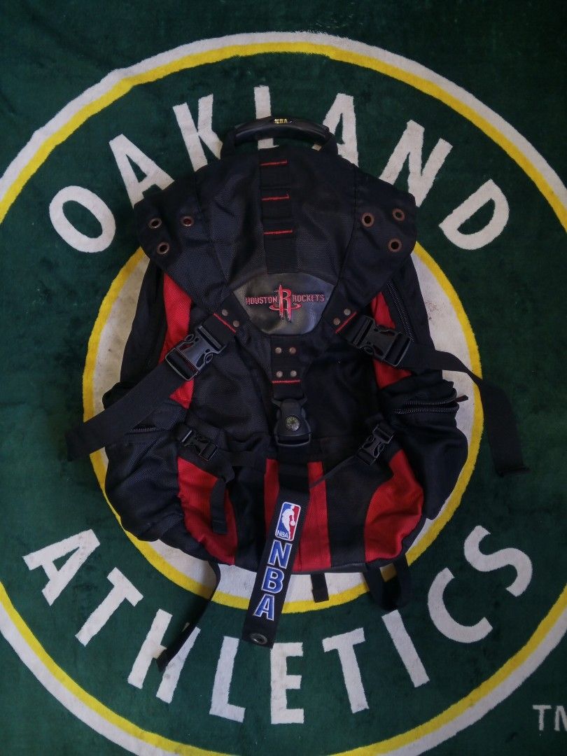 Houston Rockets NBA Backpack (Category: Backpacks) located in Las Pinas. Submitted by allhandpick (Listing ID 1450239688, Image 1). Description: - Official Houston Rockets backpack - Stylish black and red design - NBA logo detail on strap and inside pocket - Comfortable padded shoulder straps - Spacious interior for all your essentials - Durable zippers and sturdy top handle - Ideal gift for any Rockets fan.