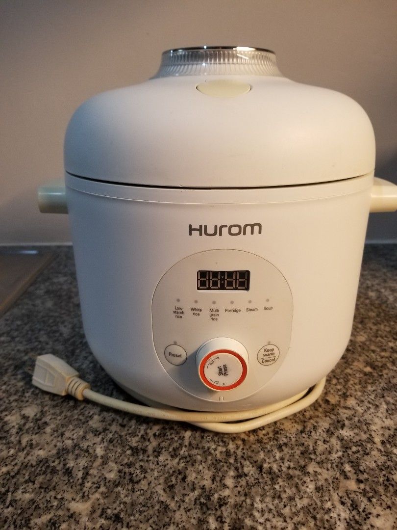 HUROM 37% Starch Reducing Rice Cooker Multi Cooker (Category: Cookers) located in Manila. Submitted by freeearth_a30d5f (Listing ID 1450148569, Image 1). Description: - HUROM 37% Starch Reducing Rice Cooker - Digital display and control panel - Durable stainless steel inner pot - Lid opens to reveal cooking chamber - Comes with a separate stainless steel bowl - Versatile for cooking rice and other dishes.