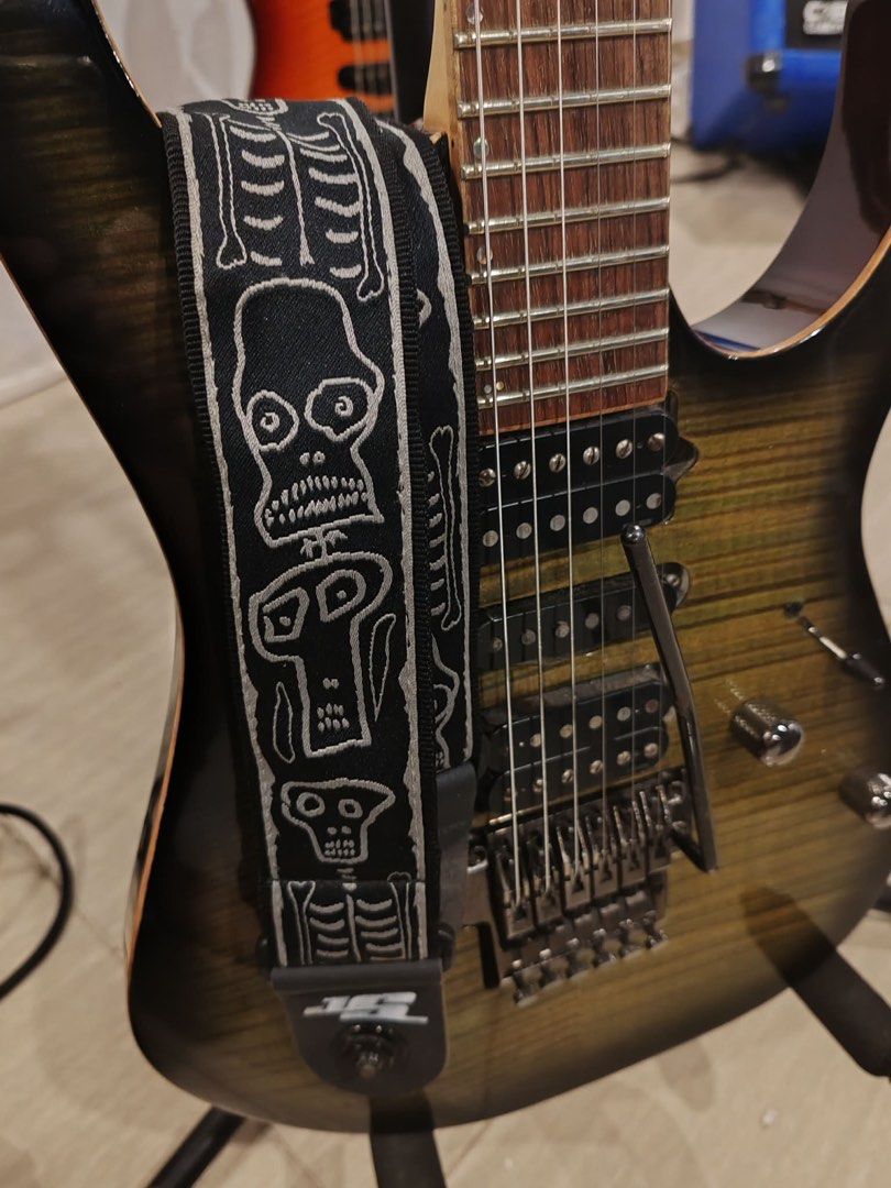 Ibanez J. Custom RG1880 (Category: Musical Instruments) located in Manila. Submitted by 12tonemusicstudioph (Listing ID 1450308411, Image 2). Description: - Ibanez J. Custom electric guitar - Stunning flame maple top with sunburst finish - Dual humbucker pickups for powerful sound - Floyd Rose tremolo system for dive bombs and vibrato - Fast, smooth neck ideal for shredding - Perfect for rock and metal music genres - Includes a cool skeleton-them