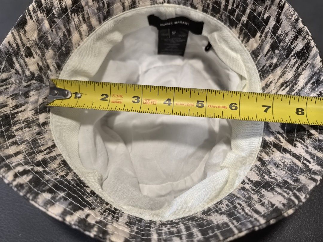 Isabel Marant Bucket Hat (Category: Hats & Beanies) located in Cagayan de Oro. Submitted by pootx (Listing ID 1450254221, Image 2). Description: Isabel Marant bucket hat. Size 57. Features a cool black and white abstract print. Made in France. 100% cotton. Great for sunny days or just adding some style to your outfit. Check out the photos for details..