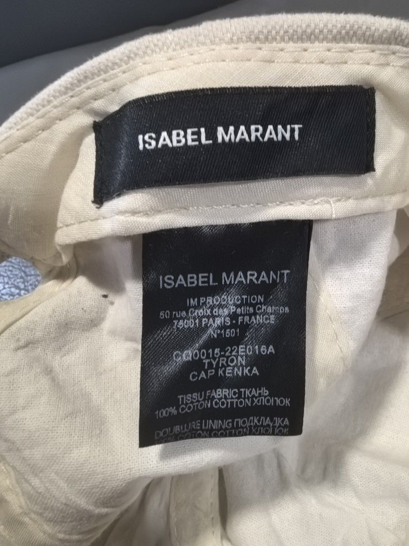 Isabel Marant Tyron Cap Kenka Beige Cotton (Category: Caps & Hats) located in Cagayan de Oro. Submitted by pootx (Listing ID 1450254887, Image 2). Description: - Isabel Marant baseball cap - Beige cotton fabric - Iconic Marant logo embroidered in purple and pink - Adjustable strap at the back - Made in France - Perfect for everyday style.