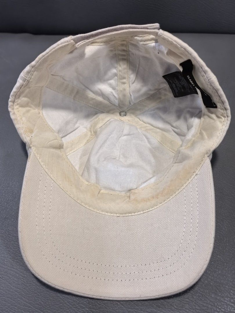 Isabel Marant Tyron Cap Kenka Beige Cotton (Category: Caps & Hats) located in Cagayan de Oro. Submitted by pootx (Listing ID 1450254887, Image 3). Description: - Isabel Marant baseball cap - Beige cotton fabric - Iconic Marant logo embroidered in purple and pink - Adjustable strap at the back - Made in France - Perfect for everyday style.