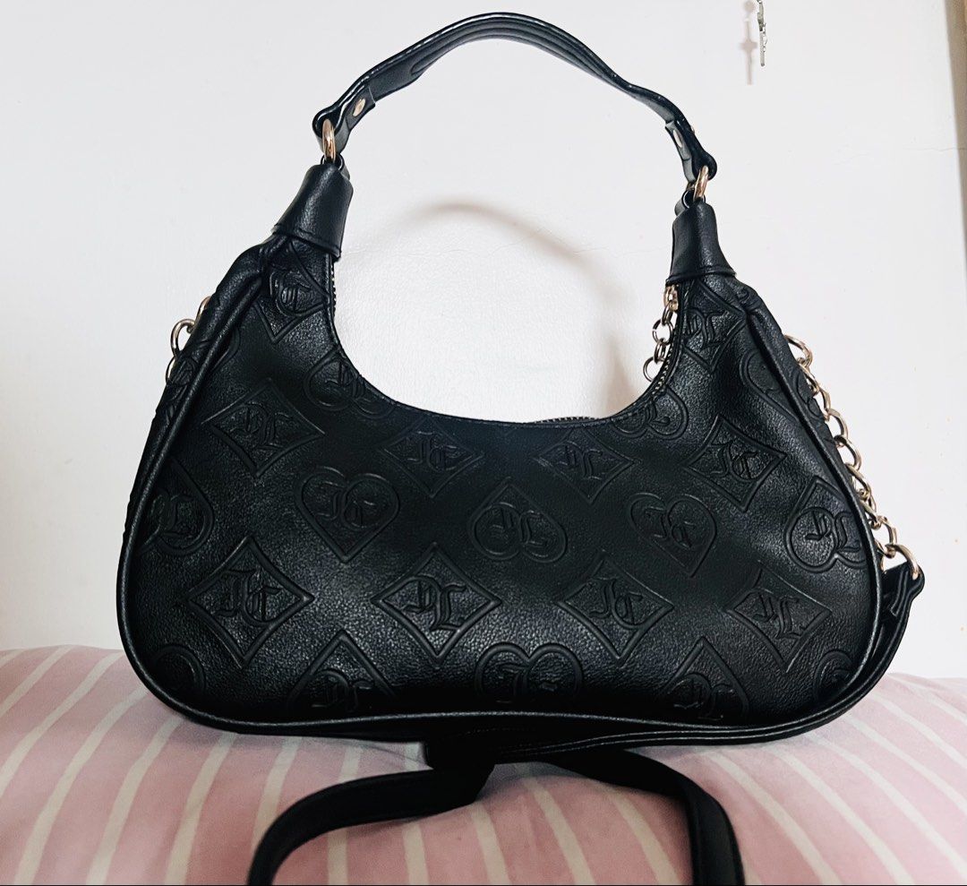Juicy Couture shoulder/crossbody bag (Category: Shoulder Bags) located in Manila. Submitted by aicalicious (Listing ID 1450159451, Image 2). Description: - Juicy Couture shoulder/crossbody bag - This is authentic and bought it from Canada - No other inclusion - Some minor dents but not visible - Slightly negotiable. No lowball offers, please. Can do meet up (around Sampaloc Manila only) or Lalamove 📩 Feel free to message me if you have any quest