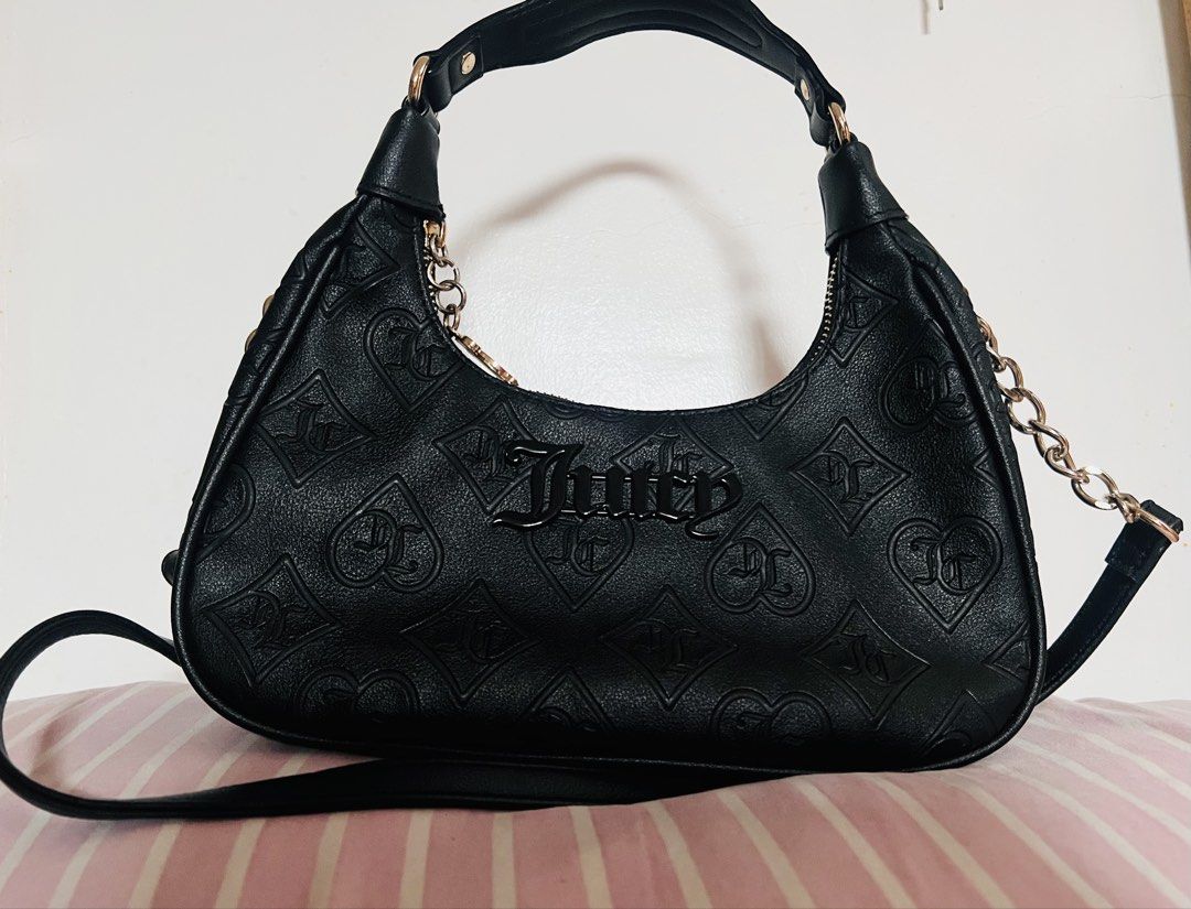 Juicy Couture shoulder/crossbody bag (Category: Shoulder Bags) located in Manila. Submitted by aicalicious (Listing ID 1450159451, Image 1). Description: - Juicy Couture shoulder/crossbody bag - This is authentic and bought it from Canada - No other inclusion - Some minor dents but not visible - Slightly negotiable. No lowball offers, please. Can do meet up (around Sampaloc Manila only) or Lalamove 📩 Feel free to message me if you have any quest