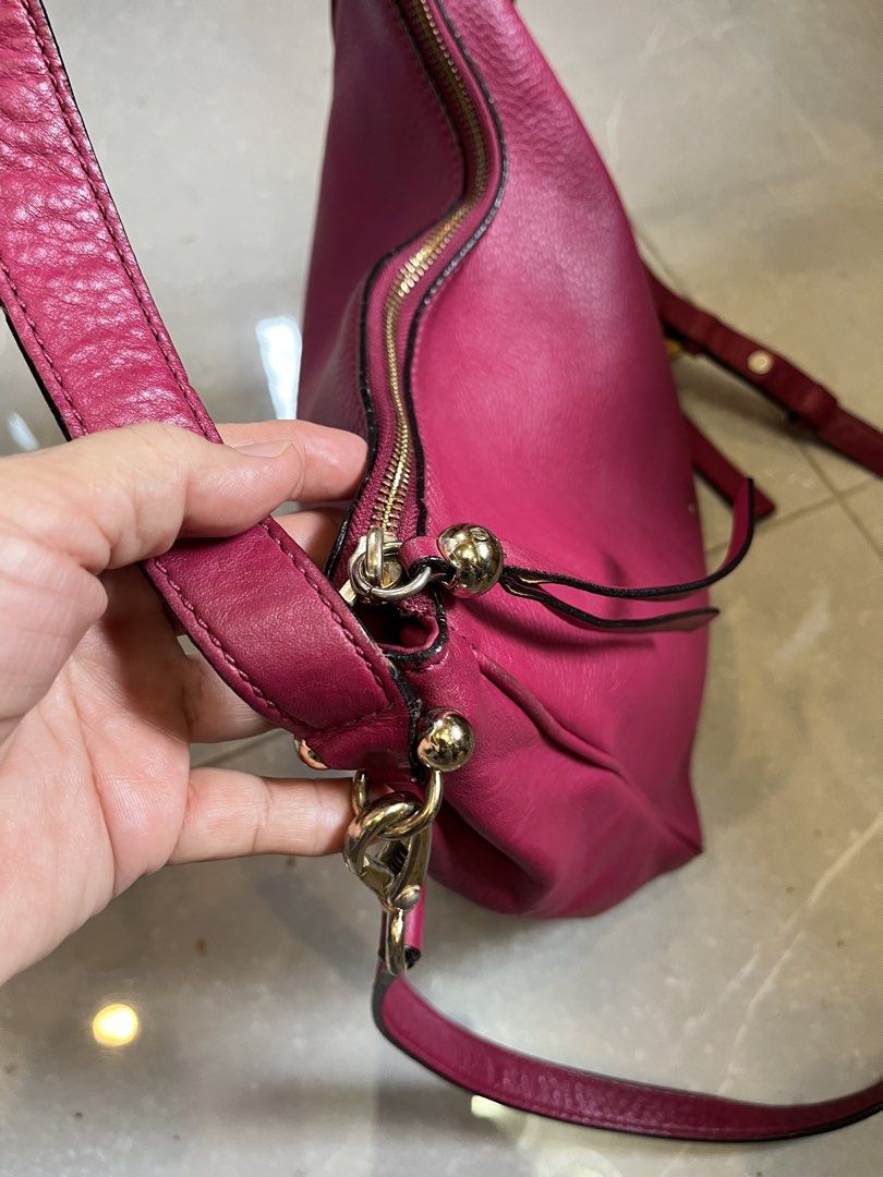 Kate Spade Pink Leather Hobo Shoulder Bag (Category: Luxury Bags & Wallets) located in Cebu City. Submitted by nbetcuban007trendyfinds (Listing ID 1450149008, Image 3). Description: - KATE Spade New York original - Stylish pink leather hobo bag - Dual carrying options: crossbody strap and top handles - Secure YKK zipper closure - Elegant gold hardware details - Spacious interior, ideal for everyday essentials - Shows some signs of wear on the str