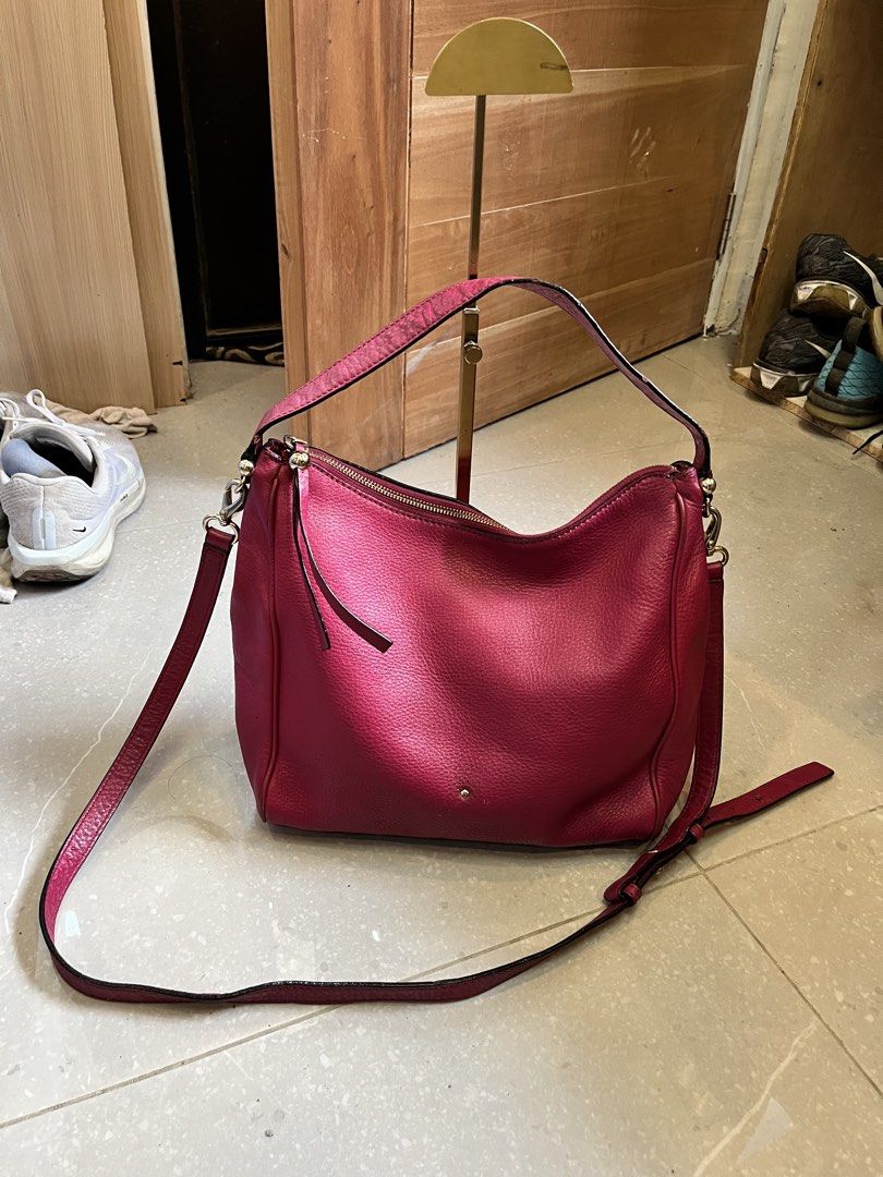 Kate Spade Pink Leather Hobo Shoulder Bag (Category: Luxury Bags & Wallets) located in Cebu City. Submitted by nbetcuban007trendyfinds (Listing ID 1450149008, Image 1). Description: - KATE Spade New York original - Stylish pink leather hobo bag - Dual carrying options: crossbody strap and top handles - Secure YKK zipper closure - Elegant gold hardware details - Spacious interior, ideal for everyday essentials - Shows some signs of wear on the str