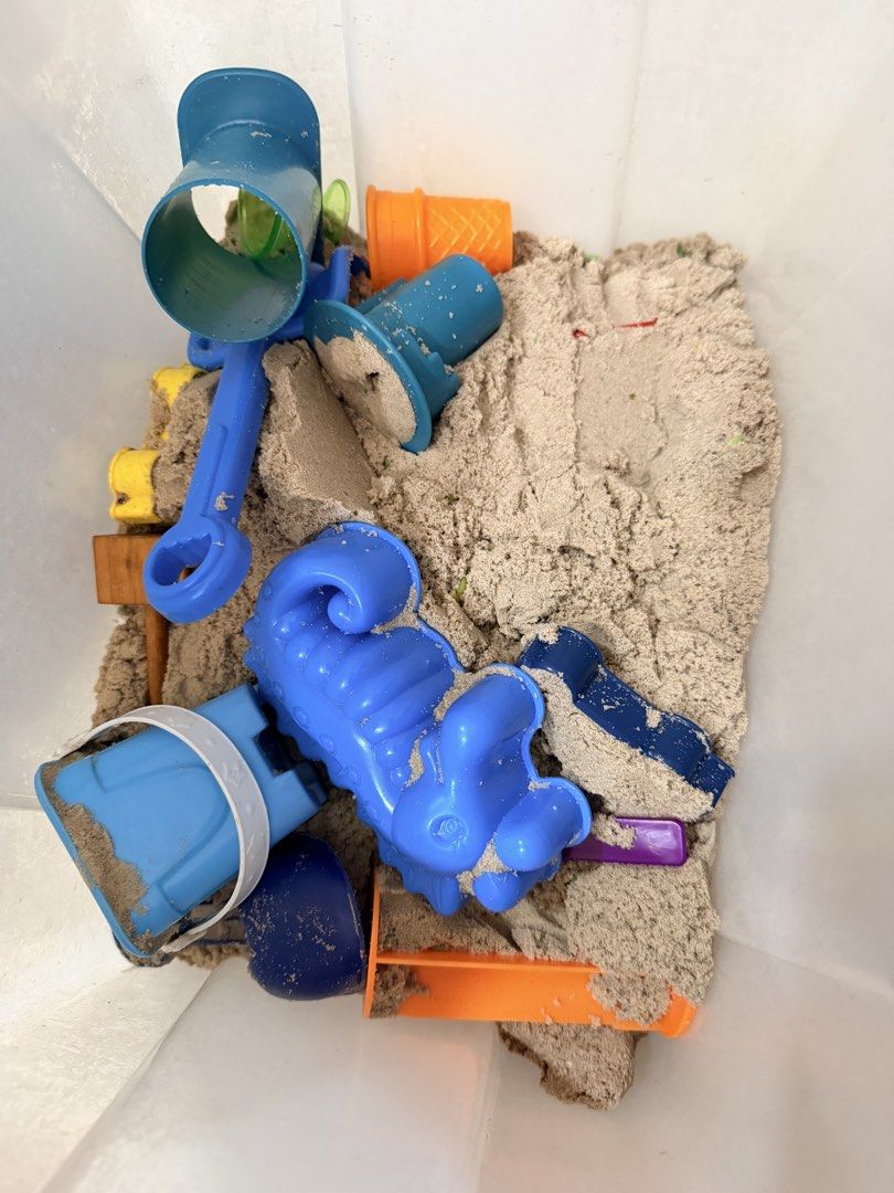 Kinetic Sand Bucket with Molds and Tools (Category: Kids Toys) located in Antipolo. Submitted by puzzleaddict (Listing ID 1450250035, Image 2). Description: - Kinetic sand bucket with molds and tools included. - Comes with blue and orange plastic accessories for building and shaping. - Soft and moldable sand, perfect for sensory play. - Great for kids' activities and creative fun. - Plenty of sand remaining in the bucket. - Some tools are stored 