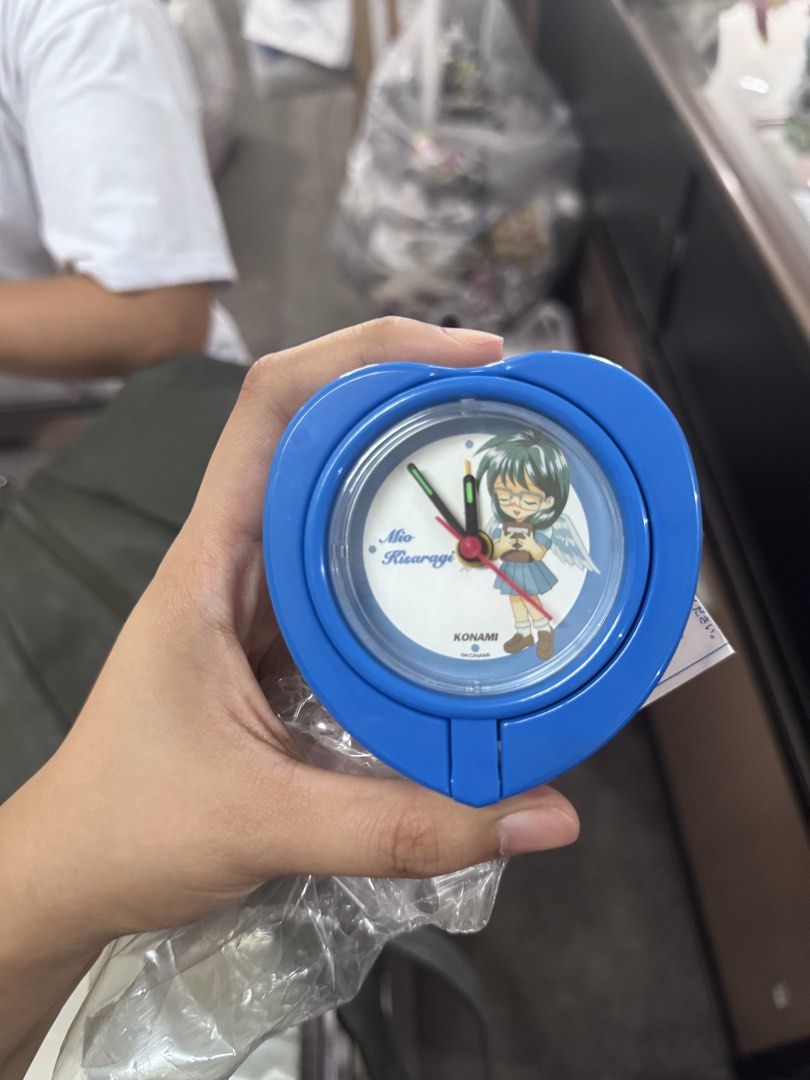 Konami Mio Kisaragi Heart Shape Alarm Clock (Category: Clocks) located in Santa Cruz. Submitted by margaret03mary (Listing ID 1450205648, Image 1). Description: - Cute heart-shaped alarm clock - Features Mio Kisaragi from Konami - Blue casing - Battery operated - Great for fans or as a quirky bedside accessory - Still in original packaging.