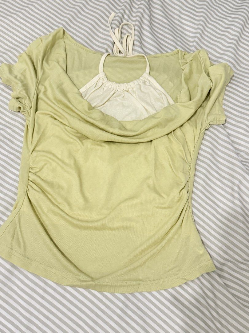 Light Green Ruched Top with White Halter Inner Top (Category: Sleeveless) located in Pasig City. Submitted by howdykoko (Listing ID 1450307195, Image 1). Description: - Light green outer top with ruched sides - Short sleeves - Tie detail at the back of the neck - Comes with a white halter neck inner top - Comfortable and stylish for casual wear - Easy to pair with jeans or skirts.