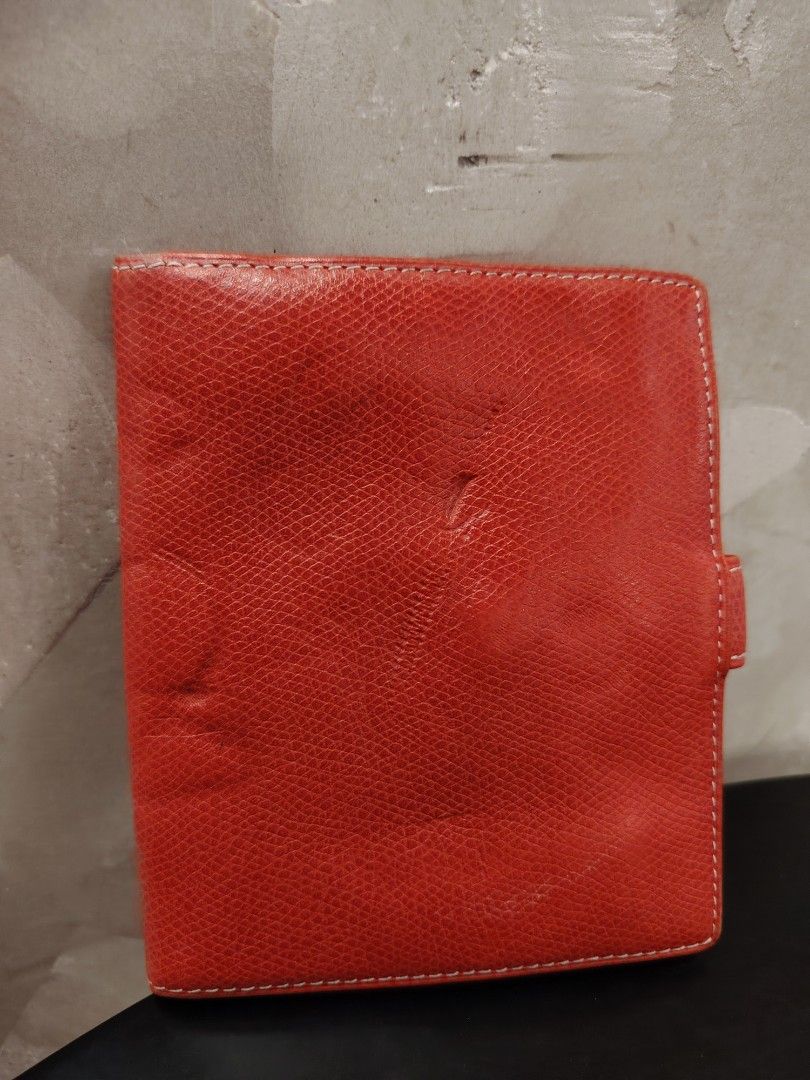Loewe Orange Leather Bifold Wallet (Category: Luxury Bags & Wallets) located in Cagayan de Oro. Submitted by michaelluxuryitems (Listing ID 1450167997, Image 3). Description: - Authentic Orange Loewe Wallet - Crafted from textured leather - Multiple interior card slots for organization - Iconic embossed Loewe anagram logo on the front - A stylish and functional wallet, perfect for everyday use.