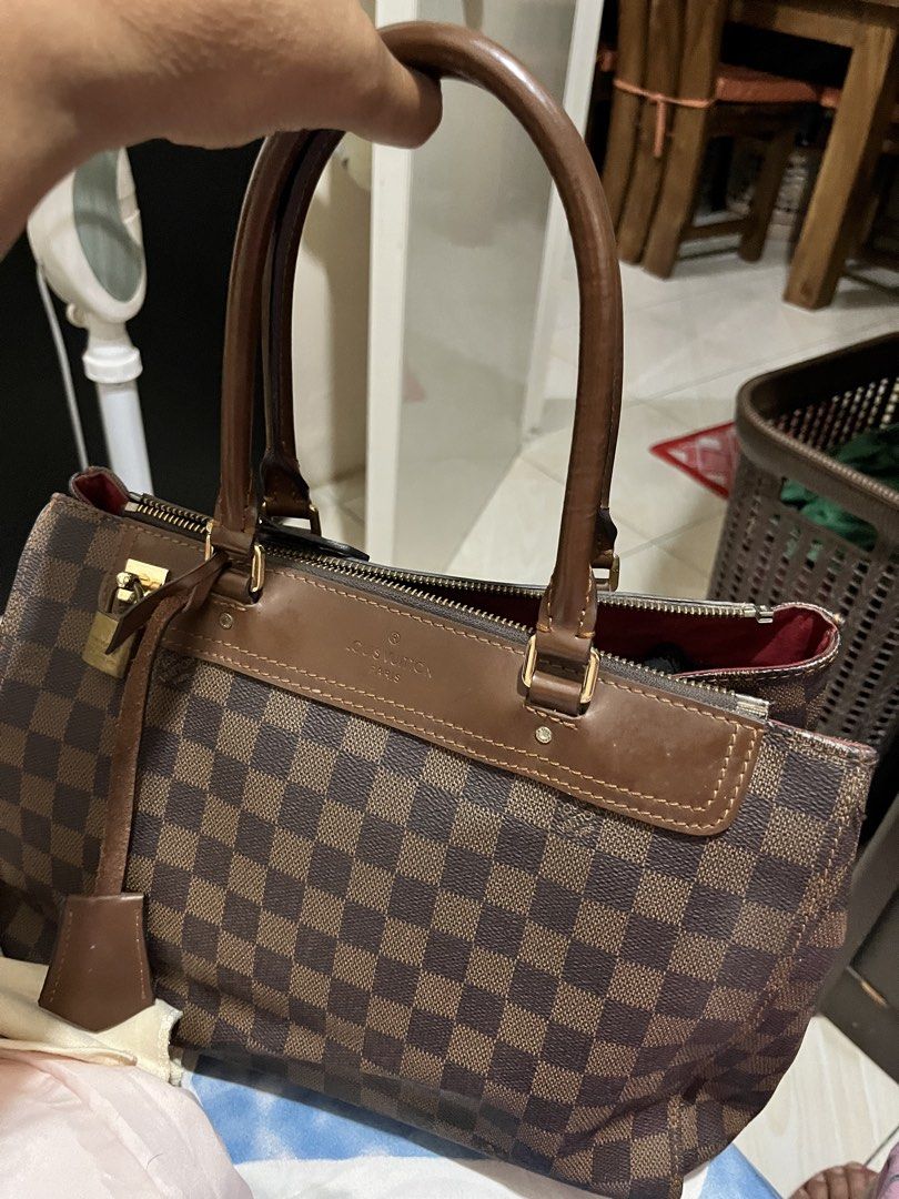 Louis Vuitton Damier Ebene Speedy 30 Handbag (Category: Luxury Bags & Wallets) located in Manila. Submitted by silvereagle_0d6c7c (Listing ID 1450190197, Image 3). Description: - Authentic Louis Vuitton Speedy 30 - Damier Ebene canvas (classic brown checkered pattern) - Genuine leather handles and trim - Secure zipper closure - Includes detachable shoulder strap - Vibrant red interior - Perfect everyday bag - Minor signs of wear on leather trim a