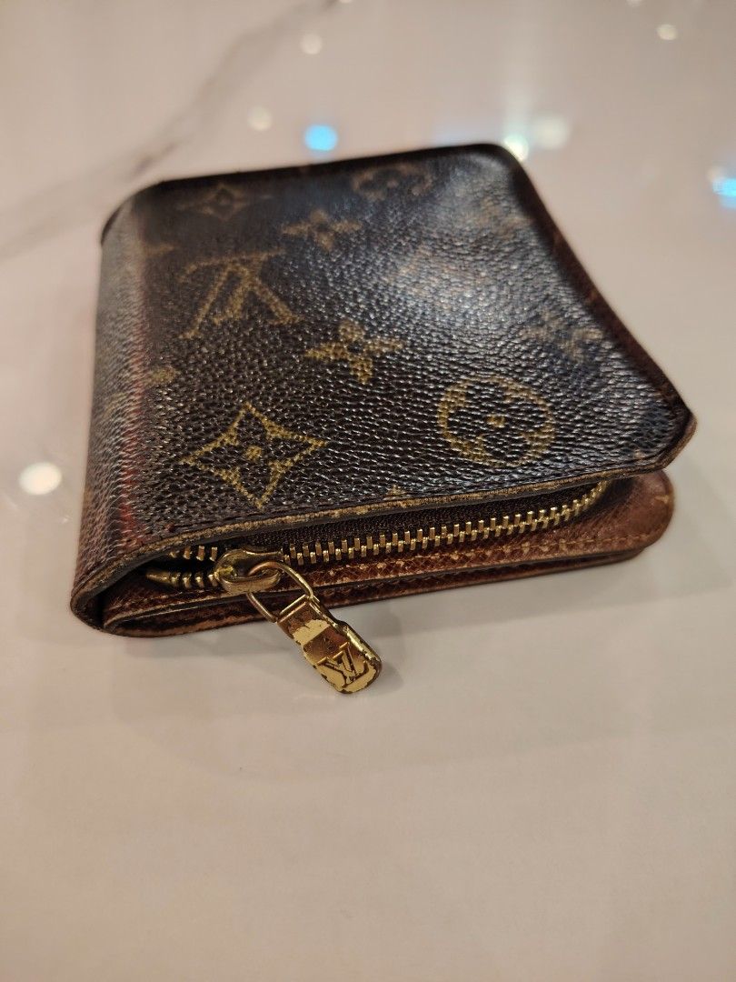 Louis Vuitton Monogram Canvas Bifold Wallet (Category: Luxury Bags & Wallets) located in Cagayan de Oro. Submitted by michaelluxuryitems (Listing ID 1450168253, Image 3). Description: - Authentic Louis Vuitton wallet - Classic monogram canvas - Snap button closure - Zippered coin pocket - Multiple card slots - Bill compartments - Timeless piece.