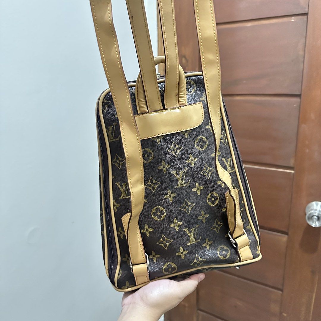 Louis Vuitton Monogram Canvas Backpack (Category: Luxury Bags & Wallets) located in Lucena. Submitted by zcareia. (Listing ID 1450278796, Image 3). Description: - Classic Louis Vuitton monogram backpack - Color: Brown canvas with tan leather trim and straps - Features a front zip pocket - Smooth working zippers - Adjustable straps for comfort - Ideal for everyday use or travel - Shows some signs of wear on leather trim and straps.