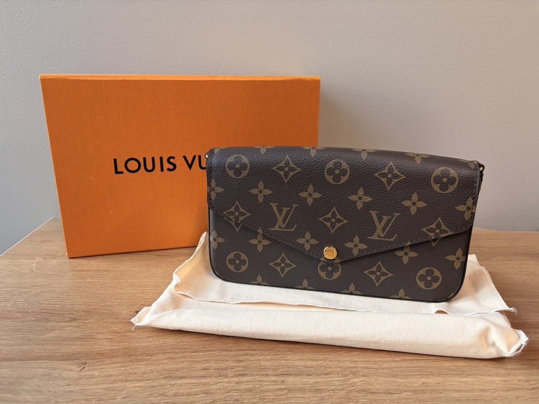 Louis Vuitton Monogram Felicie Pochette (Category: Luxury Bags & Wallets) located in Makati City. Submitted by tempting_closet (Listing ID 1450281243, Image 1). Description: - Classic Louis Vuitton monogram clutch - Envelope style with gold snap button closure - Interior features a pop of pink - Comes with original box and dust bag - Ideal for carrying your essentials.