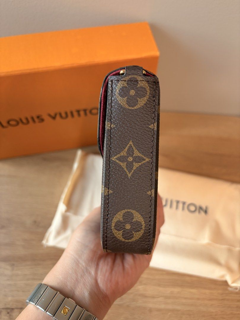 Louis Vuitton Monogram Felicie Pochette (Category: Luxury Bags & Wallets) located in Makati City. Submitted by tempting_closet (Listing ID 1450281243, Image 3). Description: - Classic Louis Vuitton monogram clutch - Envelope style with gold snap button closure - Interior features a pop of pink - Comes with original box and dust bag - Ideal for carrying your essentials.