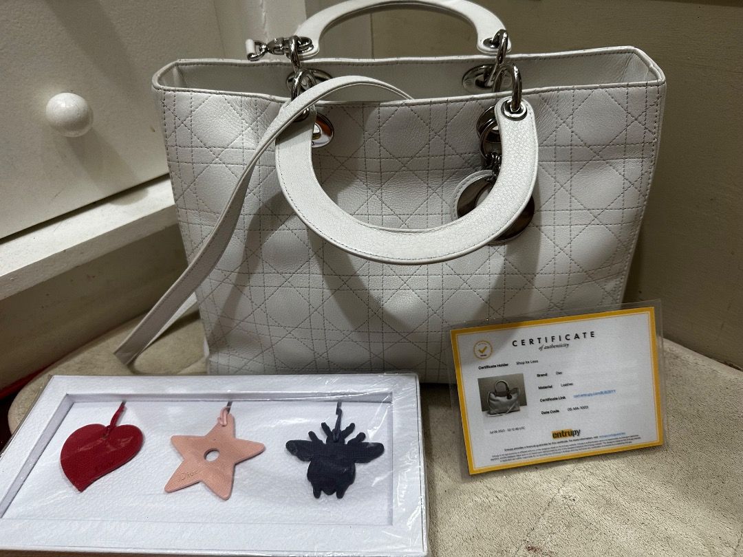 Lady Dior 2-way Hand bag (Category: Luxury Bags & Wallets) located in Quezon City. Submitted by the_archive_luxe_ph (Listing ID 1450278754, Image 2). Description: The icon. The statement. The standard. A timeless Lady Di0r in elegant ivory — crafted for those who appreciate true luxury. Model: Lady Di0r (Medium) Year 2010-2011 Brand: Christian Di0r Style: Structured top-handle with shoulder strap Signature features: * Cannage (quilted) pattern * 