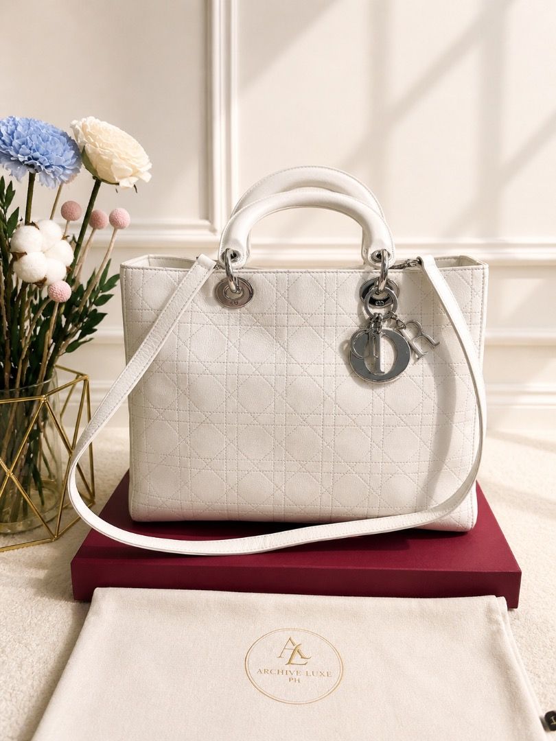 Lady Dior 2-way Hand bag (Category: Luxury Bags & Wallets) located in Quezon City. Submitted by the_archive_luxe_ph (Listing ID 1450278754, Image 1). Description: The icon. The statement. The standard. A timeless Lady Di0r in elegant ivory — crafted for those who appreciate true luxury. Model: Lady Di0r (Medium) Year 2010-2011 Brand: Christian Di0r Style: Structured top-handle with shoulder strap Signature features: * Cannage (quilted) pattern * 
