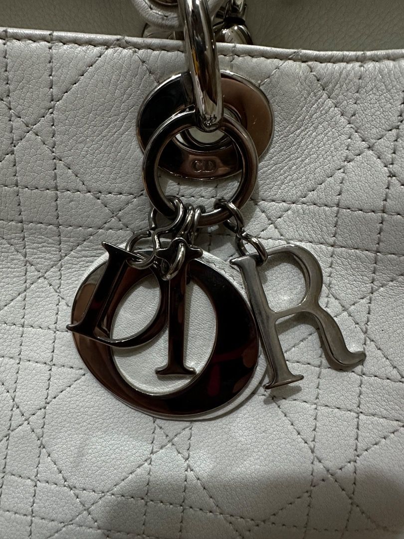 Lady Dior 2-way Hand bag (Category: Luxury Bags & Wallets) located in Quezon City. Submitted by the_archive_luxe_ph (Listing ID 1450278754, Image 3). Description: The icon. The statement. The standard. A timeless Lady Di0r in elegant ivory — crafted for those who appreciate true luxury. Model: Lady Di0r (Medium) Year 2010-2011 Brand: Christian Di0r Style: Structured top-handle with shoulder strap Signature features: * Cannage (quilted) pattern * 