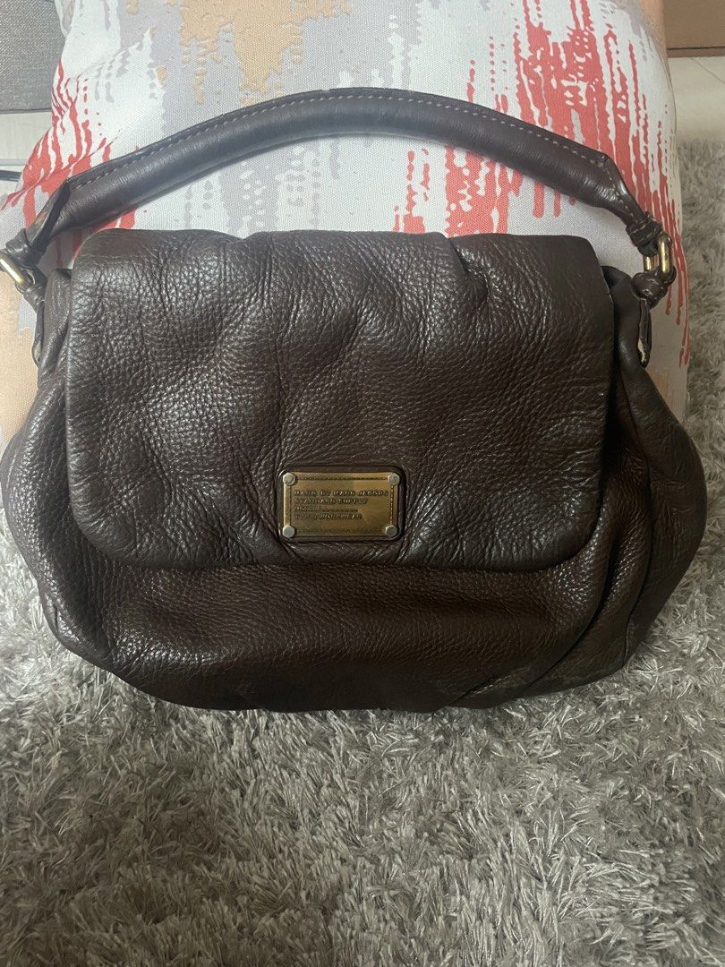 Marc Jacobs Standard Supply Brown Leather Handbag (Category: Luxury Bags & Wallets) located in Manila. Submitted by misyeli (Listing ID 1450202478, Image 1). Description: - Authentic Marc by Marc Jacobs Standard Supply handbag - Rich brown leather - Signature MJ logo print interior lining - Secure zipper closure - Comfortable carrying handles - with small stains in interior lining.