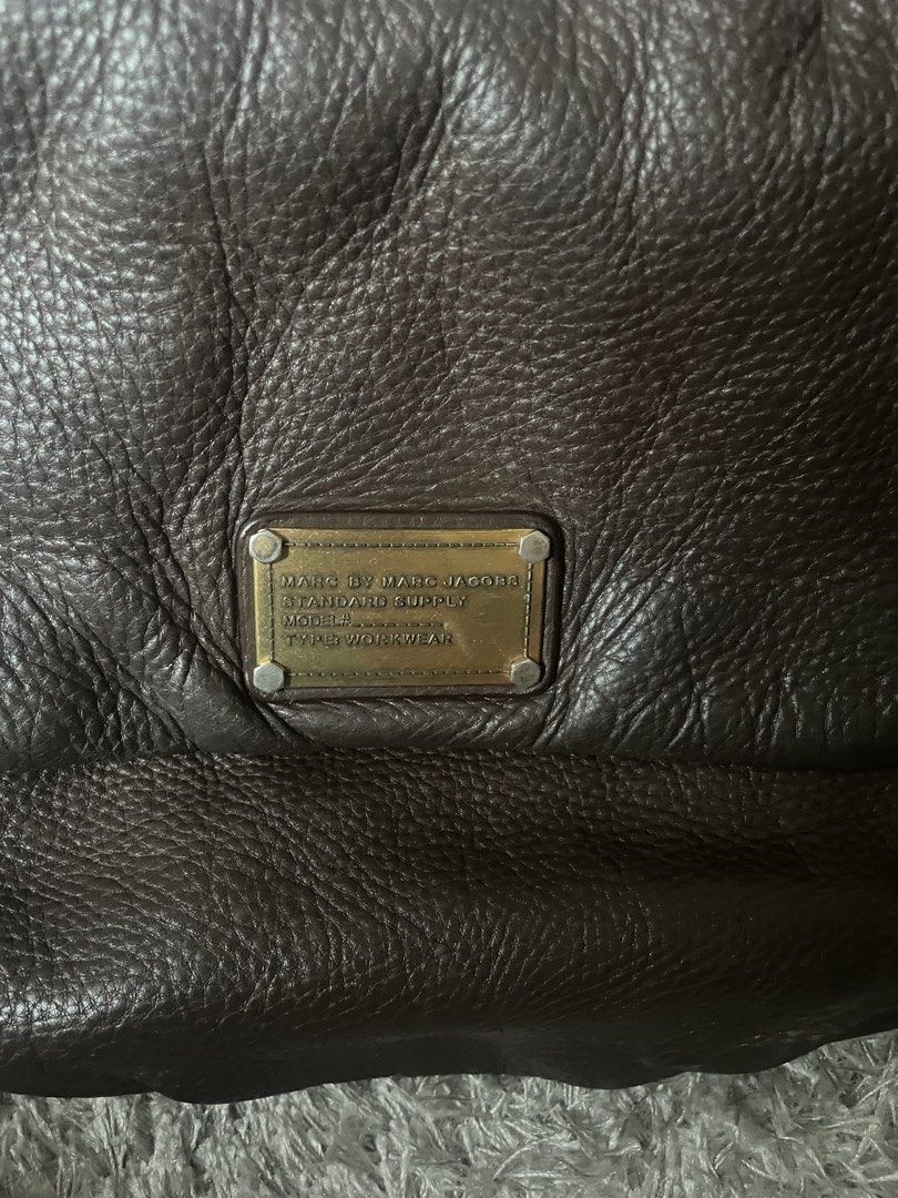 Marc Jacobs Standard Supply Brown Leather Handbag (Category: Luxury Bags & Wallets) located in Manila. Submitted by misyeli (Listing ID 1450202478, Image 2). Description: - Authentic Marc by Marc Jacobs Standard Supply handbag - Rich brown leather - Signature MJ logo print interior lining - Secure zipper closure - Comfortable carrying handles - with small stains in interior lining.