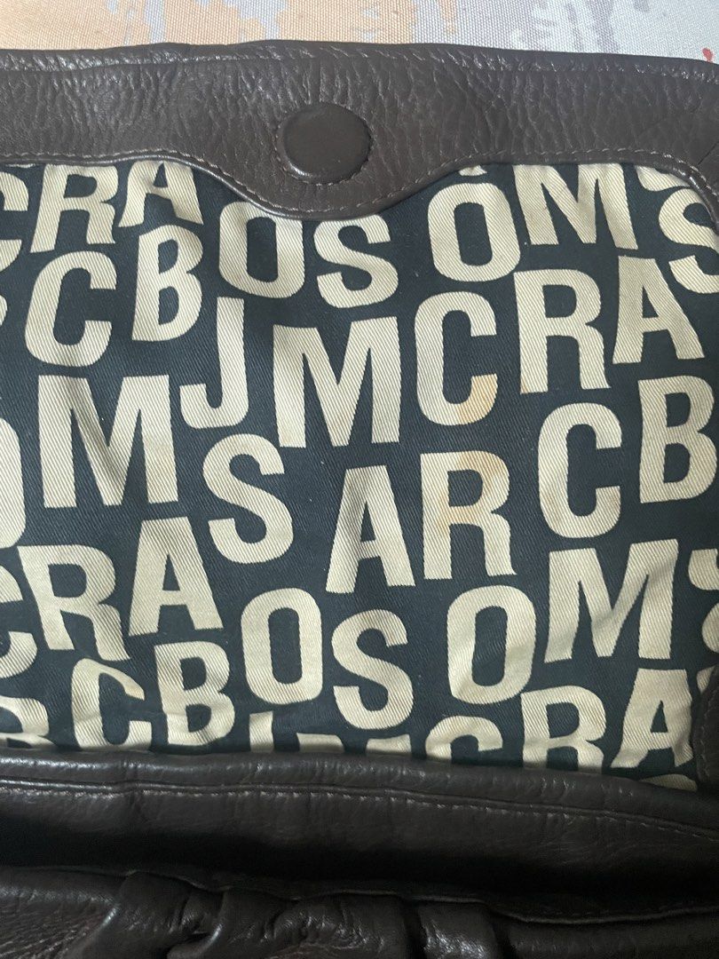 Marc Jacobs Standard Supply Brown Leather Handbag (Category: Luxury Bags & Wallets) located in Manila. Submitted by misyeli (Listing ID 1450202478, Image 3). Description: - Authentic Marc by Marc Jacobs Standard Supply handbag - Rich brown leather - Signature MJ logo print interior lining - Secure zipper closure - Comfortable carrying handles - with small stains in interior lining.