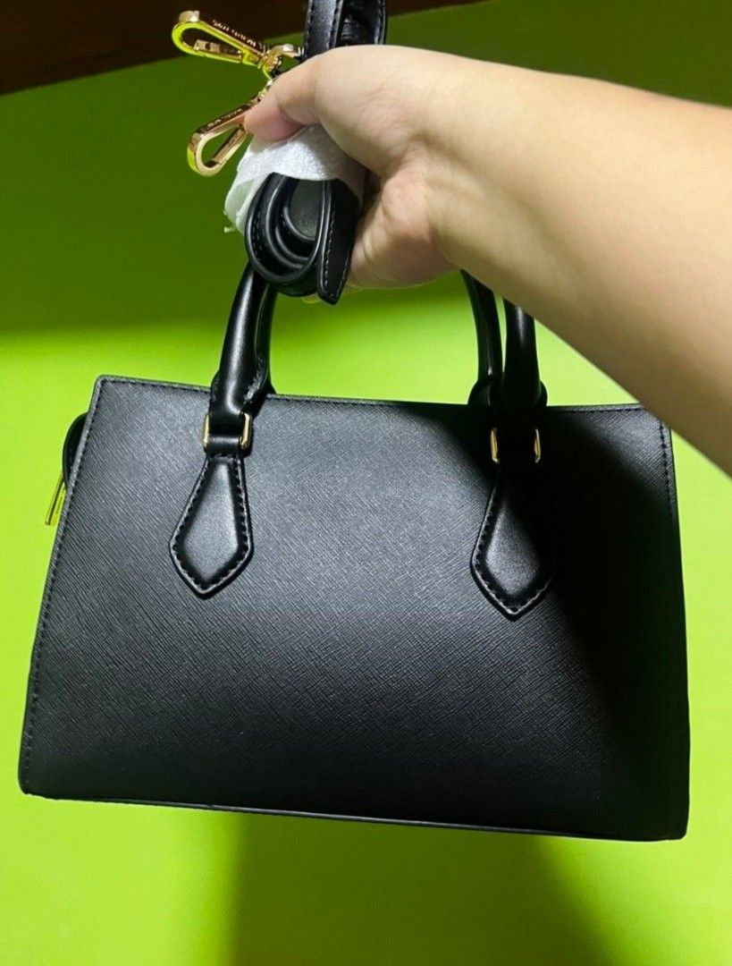 Michael Kors MK Sheila Small Black Handbag (Category: Luxury Bags & Wallets) located in San Mateo. Submitted by bambags (Listing ID 1450232081, Image 3). Description: - Michael Kors MK Sheila Bag - Color: Black - Size: Small - Material: Faux Leather - Style: Handbag or Crossbody - Hardware: Gold details - Features: Detachable strap - Ideal for: Everyday use.