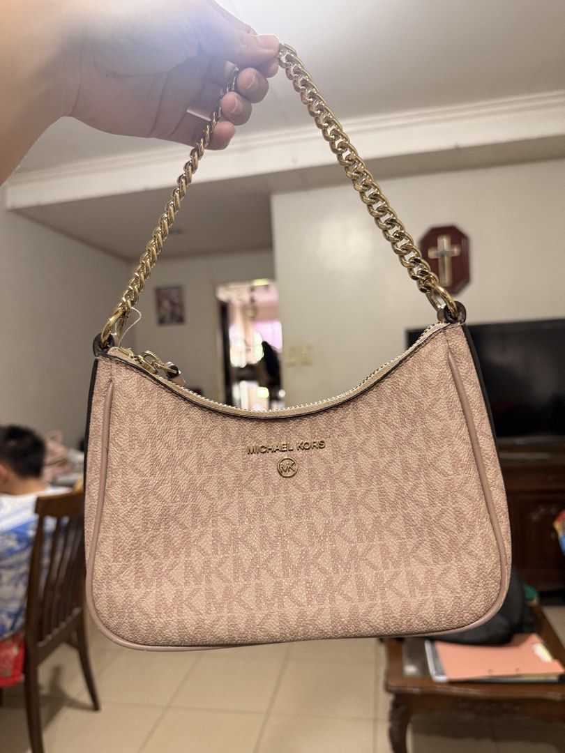 Michael Kors Monogram Shouler Bag (Category: Luxury Bags & Wallets) located in Quezon City. Submitted by katrinaroncales_ (Listing ID 1450203282, Image 2). Description: Jet Set Charm SM Chain Pouchette in Ballet - Authentic Michael Kors shoulder bag - Classic MK monogram print - Color: Light pink/beige - Gold chain strap - Zipper closure - Ideal for everyday use or nights out - Fits all your essentials - Dust bag included. This one was bought at 
