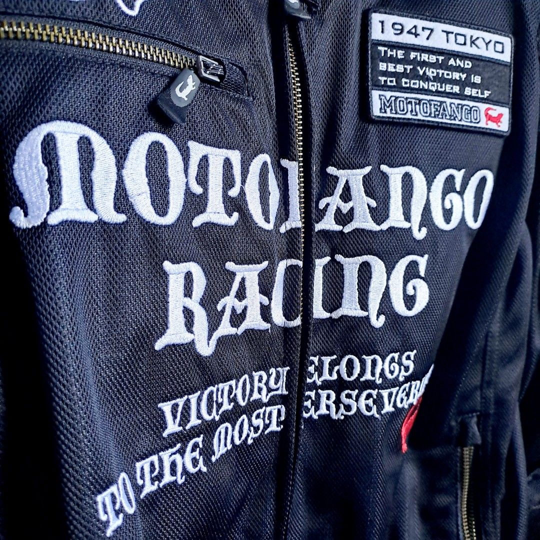Motofango Racing Motorcycle Jacket CE Approved Protectors (Category: Coats, Jackets and Outerwear) located in Manila. Submitted by moccayap23686 (Listing ID 1450143273, Image 3). Description: - Motofango Racing Jacket - Size: L - Color: Black with white and cream racing stripes - Graphics: 'Invincible' and 'Motofango Racing' on back and front - Protection: CE approved protectors by Komine - Ideal for: Riding - never used.