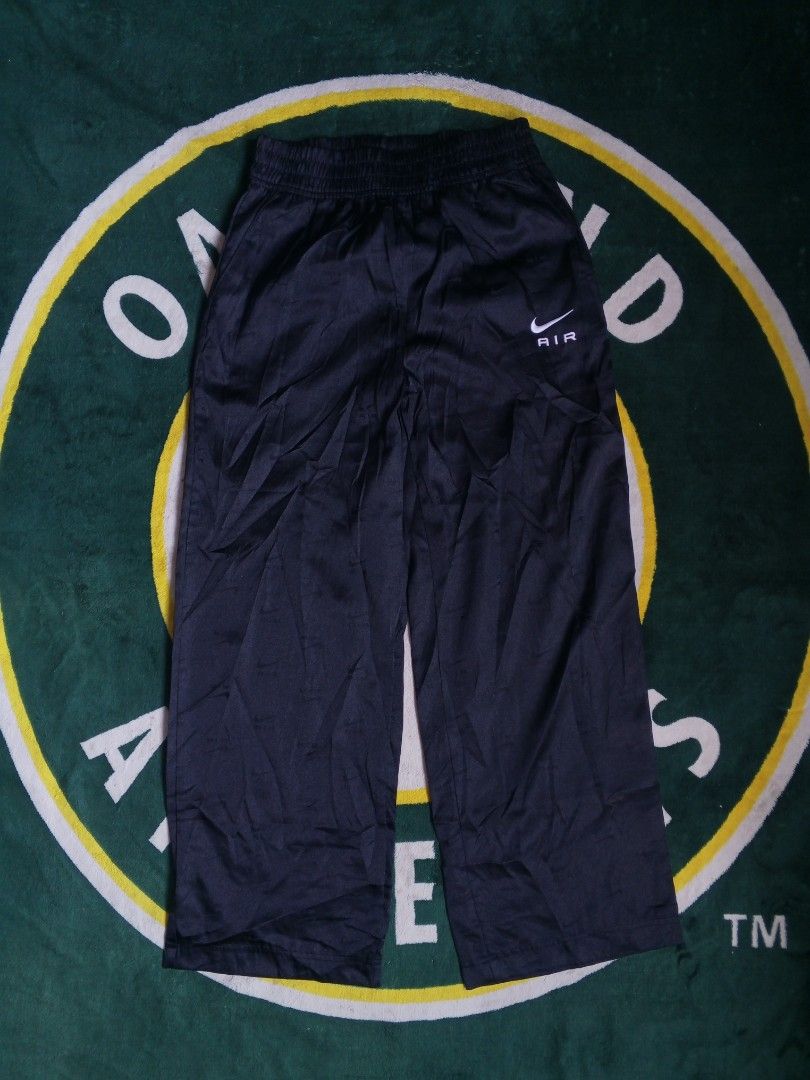 Nike Air Track Pants (Category: Joggers) located in Las Pinas. Submitted by allhandpick (Listing ID 1450239063, Image 1). Description: - Black Nike Air track pants - Elastic waistband - Fabric with a slight sheen - Nike Air logo on the left thigh - Size XS - Made in Vietnam - Ideal for casual wear or sports.