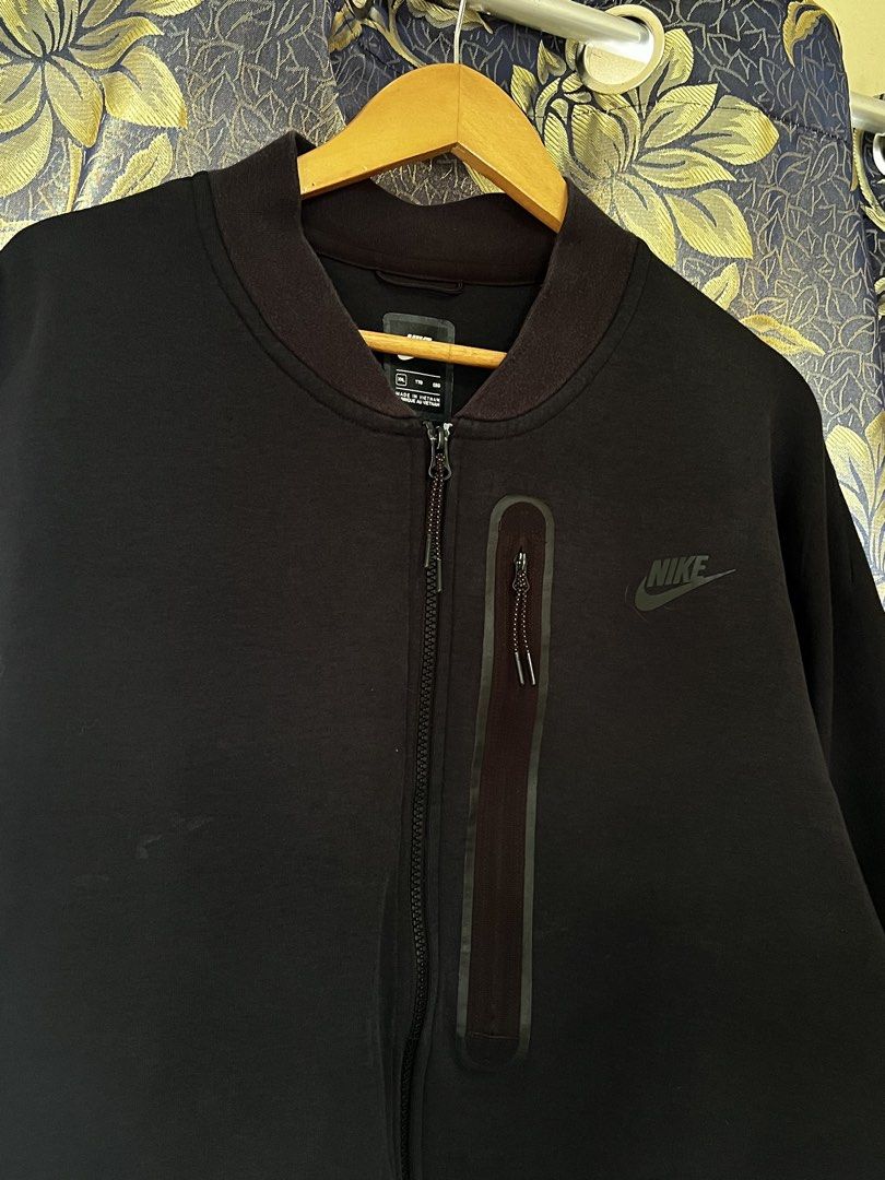 Nike Tech Fleece Bomber Jacket Black 2XL (Category: Coats, Jackets and Outerwear) located in Quezon City. Submitted by dayothrift_ph (Listing ID 1450194893, Image 2). Description: - Black Nike Tech Fleece bomber jacket - Size: 2XL - Full zip closure - Zippered chest pocket - Ribbed collar, cuffs, and hem - Subtle embroidered Nike logo on chest.