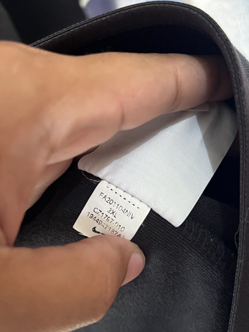 Nike Tech Fleece Bomber Jacket Black 2XL (Category: Coats, Jackets and Outerwear) located in Quezon City. Submitted by dayothrift_ph (Listing ID 1450194893, Image 3). Description: - Black Nike Tech Fleece bomber jacket - Size: 2XL - Full zip closure - Zippered chest pocket - Ribbed collar, cuffs, and hem - Subtle embroidered Nike logo on chest.