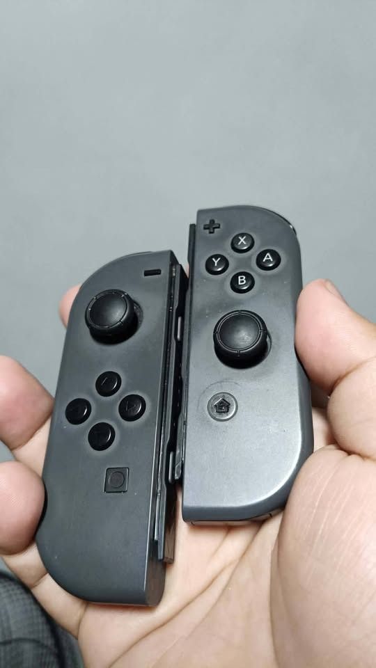 Nintendo Switch Joy-Cons (Modded Gulikit Sticks) (Category: Controllers) located in Pasig City. Submitted by sidrouf (Listing ID 1450287822, Image 1). Description: Up for sale is a pair of genuine OEM Switch Joy-Cons modded back in 2023. All buttons—including SL, SR, and all face/trigger buttons—work perfectly. Priced lower than standard non-modded Joy-Cons due to two specific cosmetic/functional quirks detailed below: 1. Hall Effect Stick Boot-U