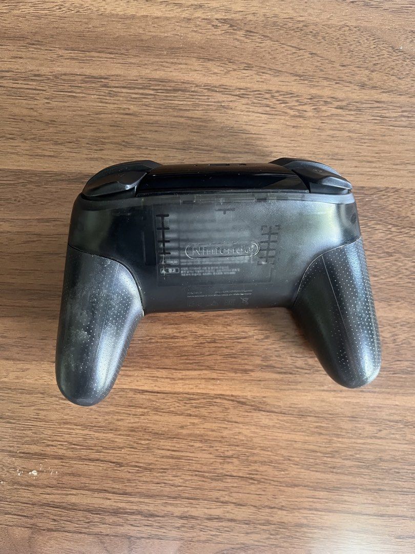 Nintendo Switch Pro Controller - Black (Category: Controllers) located in Makati City. Submitted by hvbris (Listing ID 1450200411, Image 2). Description: LAST PRICE - Nintendo Switch Pro Controller - Color: Black - Condition: Used, with minor scuffs and dust on grips/buttons from normal use - Functionality: Works great on the Switch & PC. No ghost touch. No box, no cord..