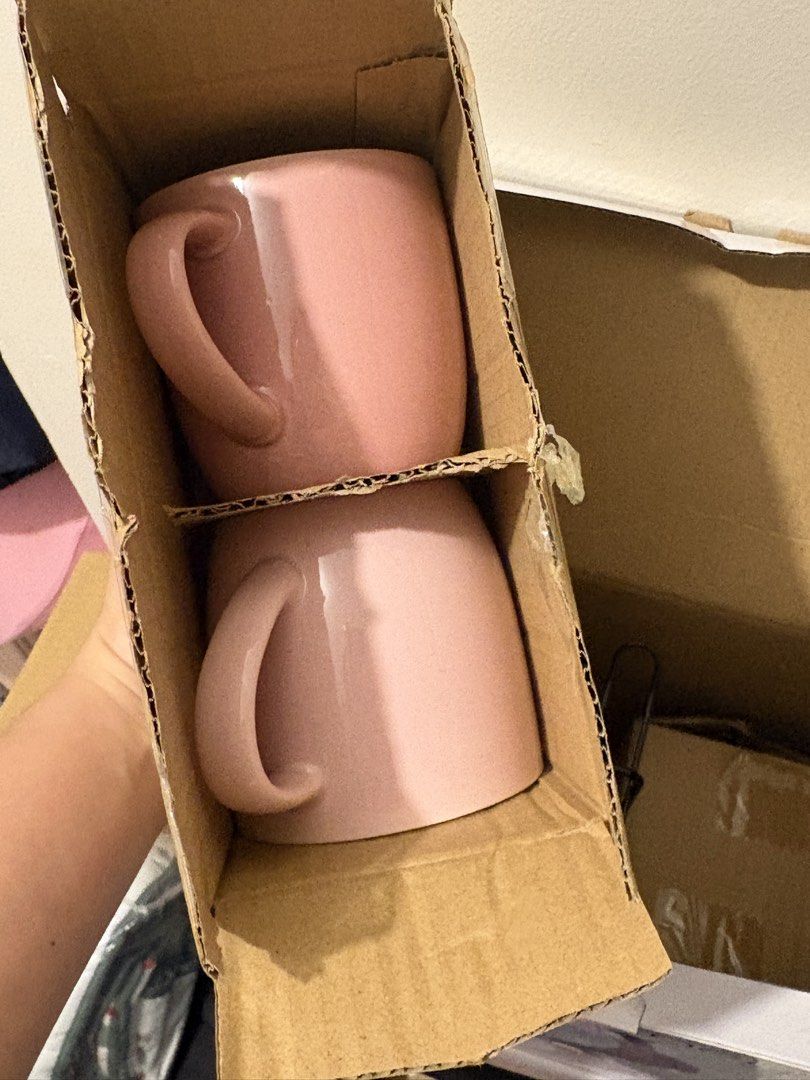 Omega Haru Mug Set with Rack - 4pcs (Category: Coffee & Tea Tableware) located in Dasmarinas. Submitted by twiceasnewph (Listing ID 1450213068, Image 2). Description: - Set of 4 Omega Haru mugs - Includes black metal rack - Two mugs in light pink - Two mugs in darker mauve - Ideal for coffee or tea - Original packaging included.