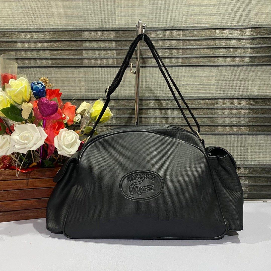 Preloved Lacoste Lora Shoulder Bag – Black (Category: Luxury Bags & Wallets) located in Binmaley. Submitted by kuriiisuuu (Listing ID 1450313374, Image 1). Description: Preloved Lacoste Lora Shoulder Bag – Black ✨ Preloved — kindly manage expectations po since this is a used item. Authenticity is not guaranteed. Buy at your own risk. 📌 Type: Shoulder Bag 📌 Details: • Lacoste Lora Shoulder Bag • Classic black color • Prominent rubber Lacoste log