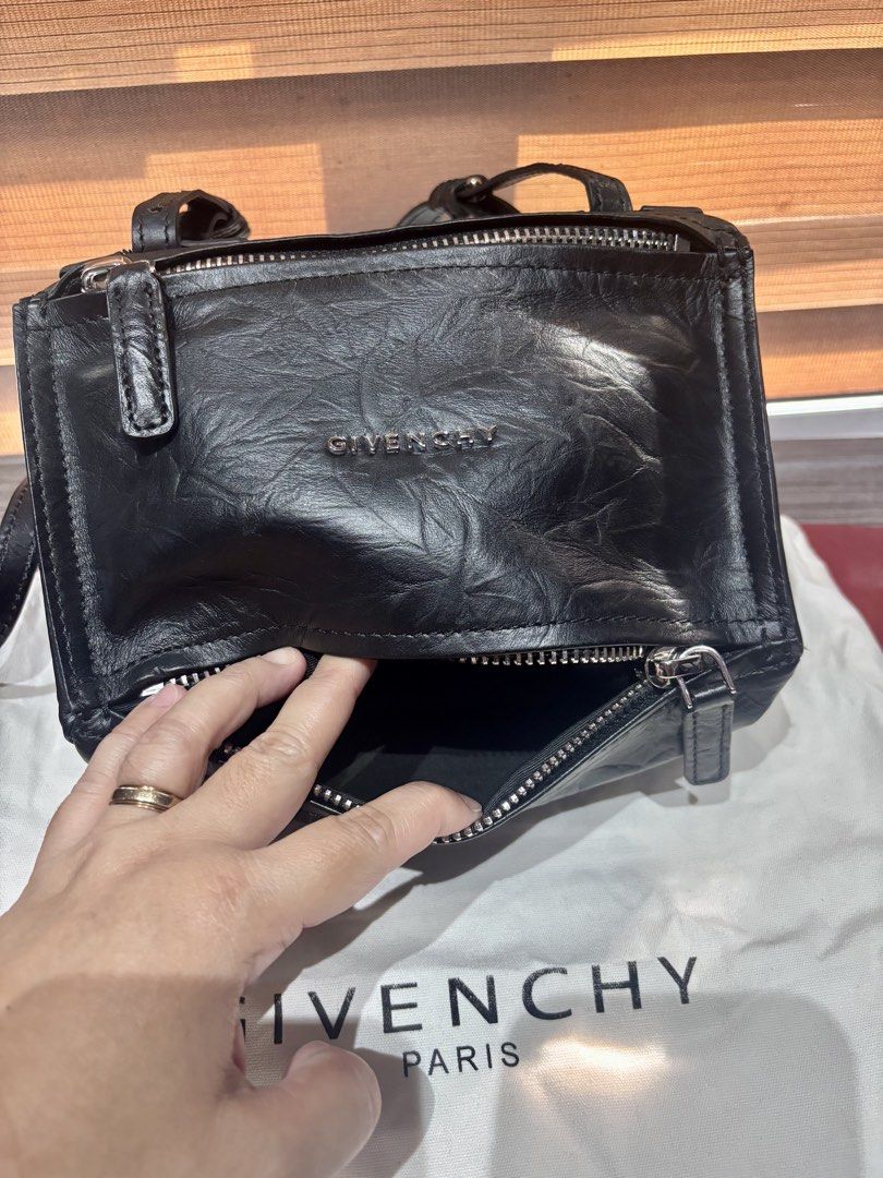 Preowned Pandora Crossbody Bag (Category: Shoulder Bags) located in Malolos. Submitted by cheerz21 (Listing ID 1450214870, Image 3). Description: Preowned Pandora Small Bag Can be used as crossbody and shoulder bag color Black; Coded Adjustable and removable strap No flaws/ issues Personal preloved bag, w/ dustbag No return, no exchange #Pandorabag #crossbodybag #shoulderbag #Givenchy #Givenchybag #ladiesbag #womensbag #bags.