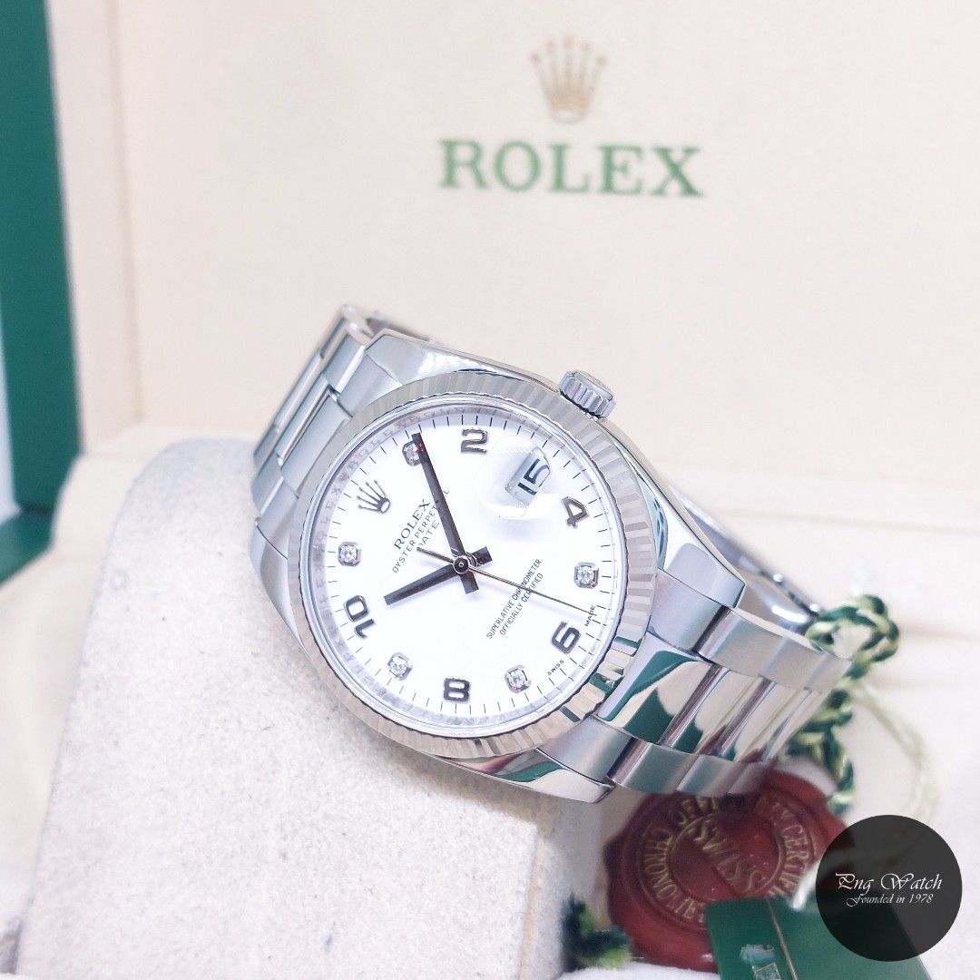 Rolex 34mm White Diamonds Dial Oyster Perpetual Date REF: 115234 (Box, Cert & Tags-2014) (Category: Watches) located in Singapore. Submitted by pngwatchdealer (Listing ID 1450251150, Image 1). Description: [SPECIFICATIONS] **Watch comes in full option (Box, Cert & Tags)** **Straight bracelet** Brand: Rolex Model: Oyster Perpetual Date 34mm White Diamonds Dial (REF: 115234)(AN)(14)(O) Movement: Automatic (Self-Winding) Functions and Features: Date