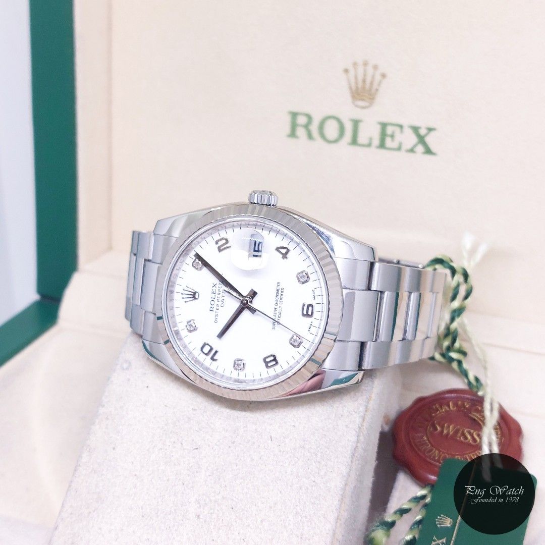 Rolex 34mm White Diamonds Dial Oyster Perpetual Date REF: 115234 (Box, Cert & Tags-2014) (Category: Watches) located in Singapore. Submitted by pngwatchdealer (Listing ID 1450251150, Image 2). Description: [SPECIFICATIONS] **Watch comes in full option (Box, Cert & Tags)** **Straight bracelet** Brand: Rolex Model: Oyster Perpetual Date 34mm White Diamonds Dial (REF: 115234)(AN)(14)(O) Movement: Automatic (Self-Winding) Functions and Features: Date
