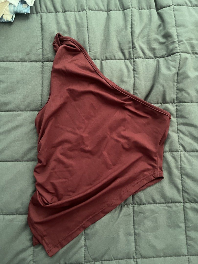 SHEIN One Shoulder Ruched Crop Top (Category: Sleeveless) located in Cavite. Submitted by Djbstuff (Listing ID 1450205773, Image 1). Description: - Stylish maroon one-shoulder crop top - Features a flattering ruched detail on the side - Made from comfortable, stretchy material - Perfect for nights out or casual wear.
