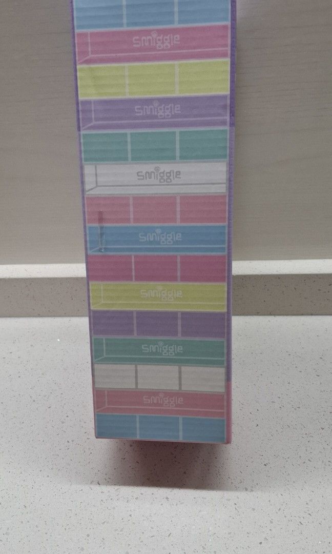 Smiggle Stack 'Em Stacking Game (Category: Board Games & Puzzles) located in Singapore. Submitted by twinkle8ight (Listing ID 1450187157, Image 2). Description: - Smiggle Stack 'Em game - Perfect for family game nights or playing with friends - Comes in original packaging - Simple and fun stacking gameplay.