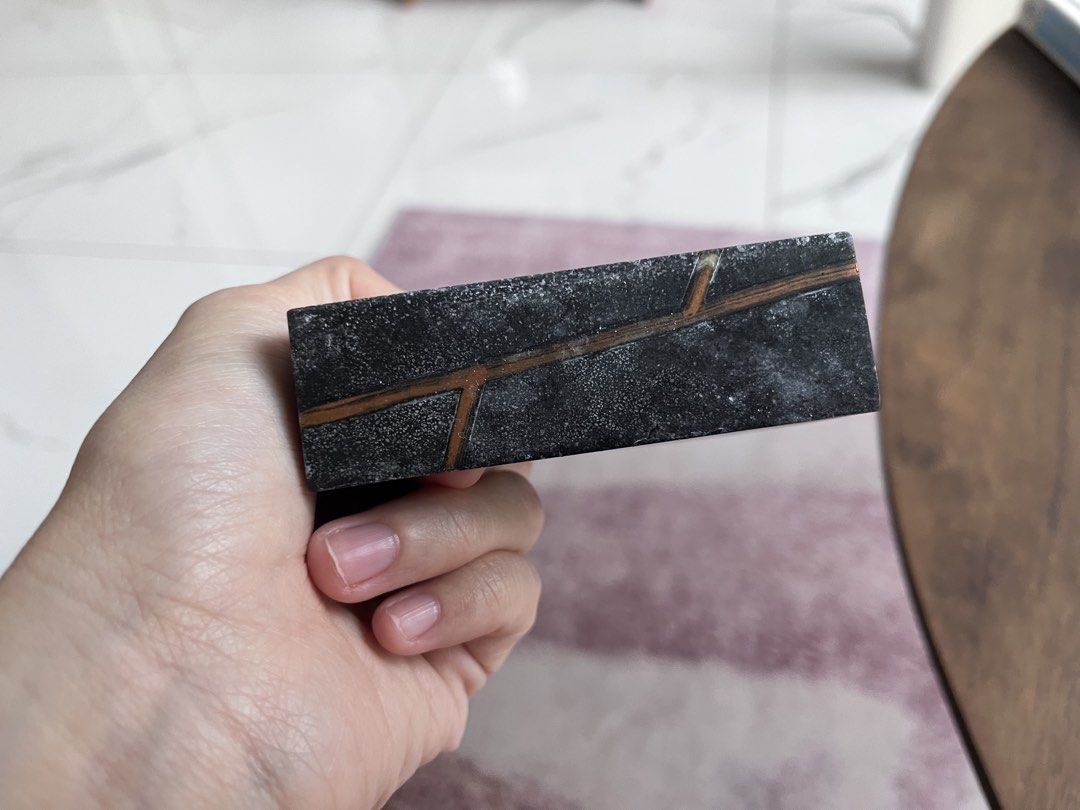 Soap Tray - Rectangular Stone Tray with Copper Inlay (Category: Bathroom & Kitchen Fixtures) located in Subang Jaya. Submitted by lilmissandria (Listing ID 1450319974, Image 3). Description: - Dark grey stone tray - Speckled texture - Unique copper inlay resembling branches/veins - Rectangular shape - Solid piece, ideal for display or organizing small items.