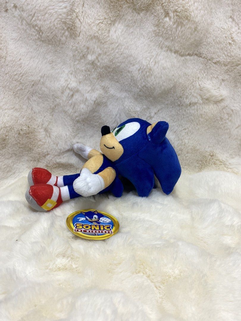 Sonic the Hedgehog Plush Toy SEGA (Category: Plushies & Soft Toys) located in Kalibo. Submitted by ollie_stuffshop (Listing ID 1450278475, Image 2). Description: 20cm x 13cm Before you send your inquiries: ❗️Last Price is already posted ❗️Manage your expectations, WYSIWYG ❗️May need washing ❗️Shipping day is every Sunday - Cute Sonic the Hedgehog plush toy - Soft and cuddly material - Includes original tags - Perfect for Sonic fans and collectors