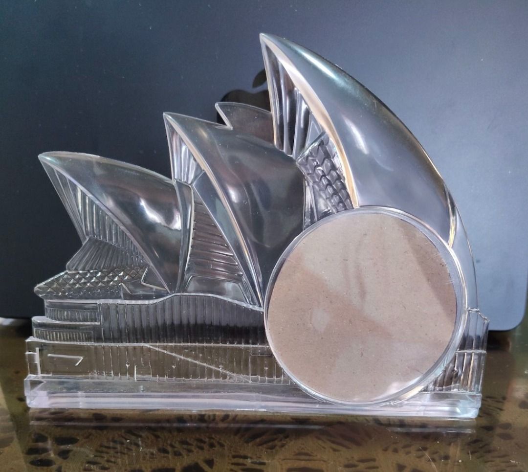 Xmas Discount!!! Sydney Opera House Acrylic Picture Frame (Category: Frames & Pictures) located in Quezon City. Submitted by oddduck02 (Listing ID 1450187801, Image 1). Description: - Acrylic Sydney Opera House Picture Frame - Minor flaws/scratches on acrylic surface - Pictures has a 3inch round area for photos. Approxi mate size of picture frame is L = 7inches / H = 5 1/2inches - Picture also shows how to open round area to insert picture. - Ins