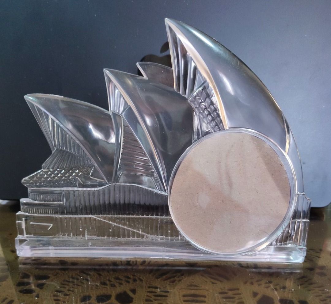 Xmas Discount!!! Sydney Opera House Acrylic Picture Frame (Category: Frames & Pictures) located in Quezon City. Submitted by oddduck02 (Listing ID 1450187801, Image 2). Description: - Acrylic Sydney Opera House Picture Frame - Minor flaws/scratches on acrylic surface - Pictures has a 3inch round area for photos. Approxi mate size of picture frame is L = 7inches / H = 5 1/2inches - Picture also shows how to open round area to insert picture. - Ins