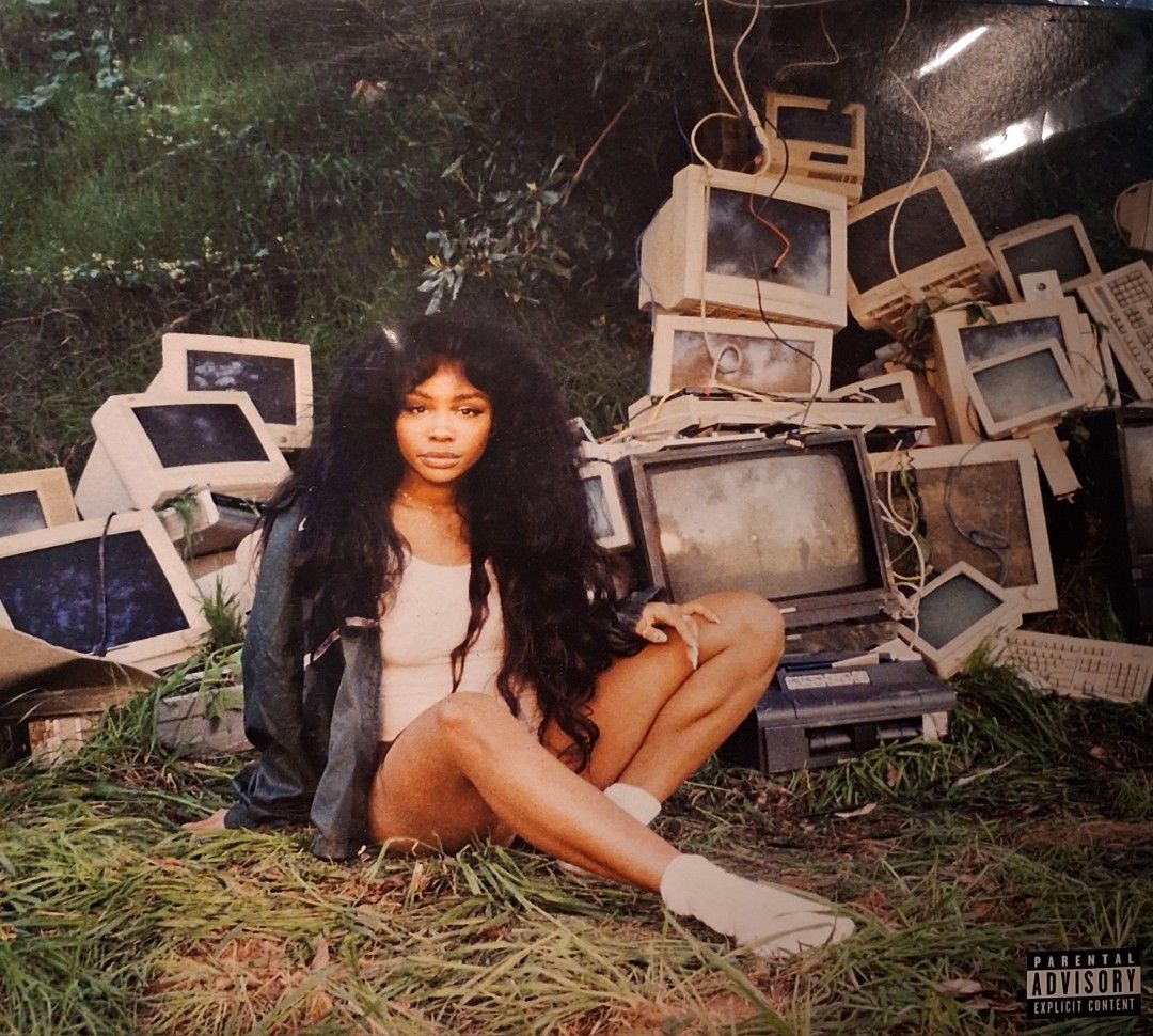 SZA "Ctrl" Album Cover Art (Category: Vinyls) located in Quezon City. Submitted by pooh_laa (Listing ID 1450201308, Image 1). Description: - High-quality print of SZA's iconic Ctrl album cover. - Features SZA sitting in grass with old computer monitors. - A must-have for any SZA fan's collection..