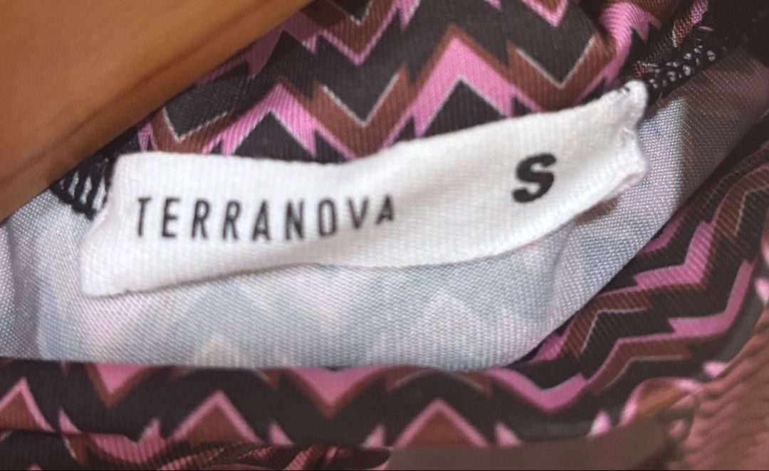 Terranova Pink & Black Keyhole Top (Category: Shirts) located in Mandaue City. Submitted by offthehanger26 (Listing ID 1450187305, Image 2). Description: - Cute zigzag print top - Colors: Pink, black, and brown - Features short sleeves, mock neck, and front keyhole cutout - Made with stretchy material for comfort - Ideal for casual outfits.