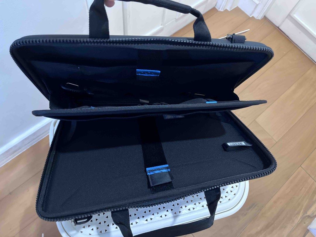 THULE Gauntlet Attaché Laptop Sleeve Case (Category: Laptop Bags & Sleeves) located in Manila. Submitted by this_is_my_closet (Listing ID 1450183225, Image 1). Description: - Black Thule laptop sleeve - Fits devices up to 14 inches - Durable hard shell exterior for maximum protection - Internal straps to keep your laptop securely in place - Built-in handle for easy portability - Ideal for travel and daily commutes - Ensures your tech stays safe a
